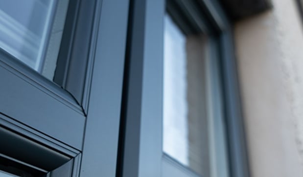 A house in Scotland freshly rejuvenated with its UPVC windows expertly sprayed, giving them a vibrant, brand-new appearance.